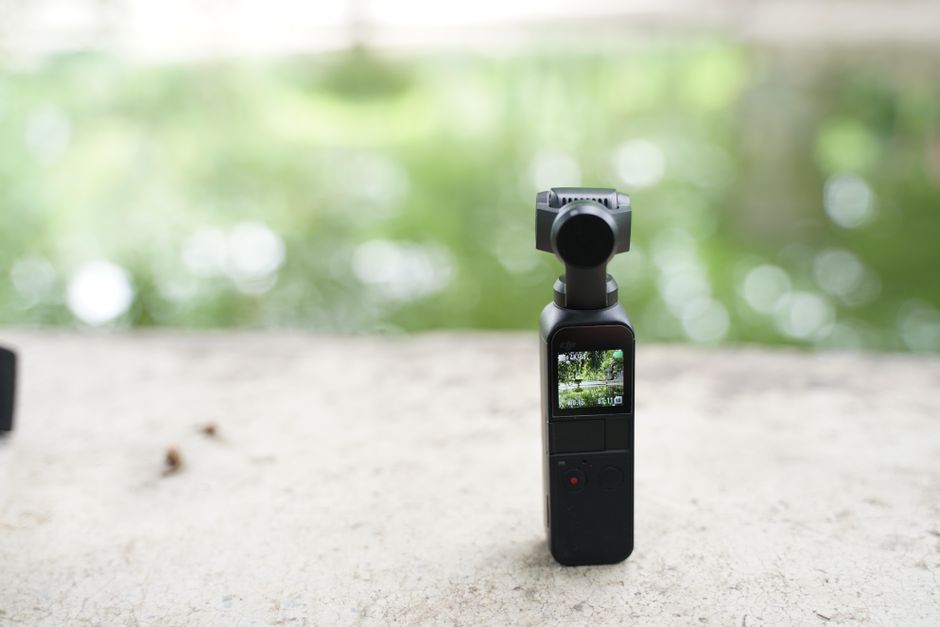 Pocket gimbal camera held while filming on the move